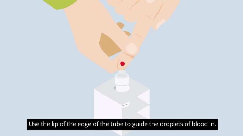 A screenshot of an animated illustration showing how to guide a droplet of blood from a finger into a tube.